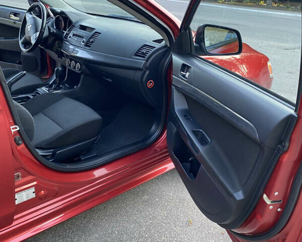 Червоний Міцубісі Lancer, об'ємом двигуна 2 л та пробігом 153 тис. км за 6700 $, фото 17 на Automoto.ua