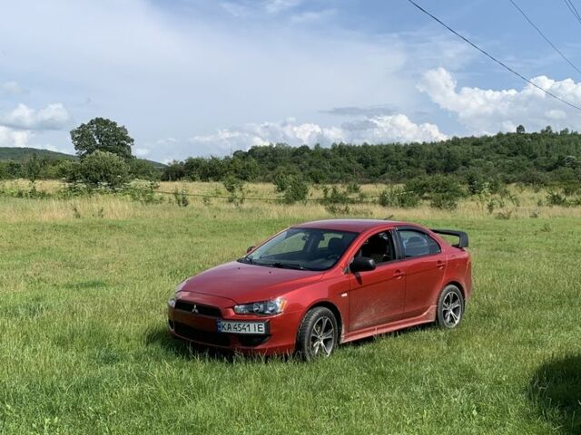 Червоний Міцубісі Lancer, об'ємом двигуна 2 л та пробігом 305 тис. км за 6500 $, фото 1 на Automoto.ua