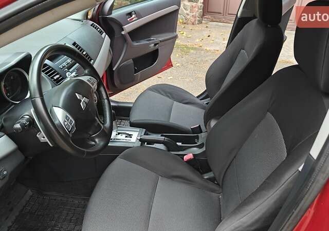 Красный Мицубиси Лансер, объемом двигателя 2 л и пробегом 186 тыс. км за 5600 $, фото 16 на Automoto.ua