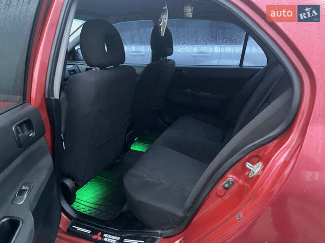 Красный Мицубиси Лансер, объемом двигателя 1.58 л и пробегом 269 тыс. км за 3899 $, фото 5 на Automoto.ua