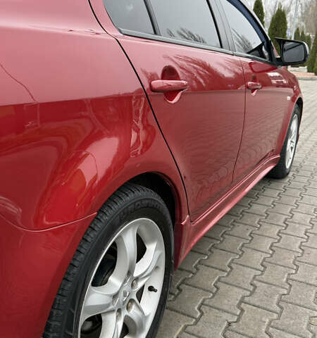 Красный Мицубиси Лансер, объемом двигателя 2 л и пробегом 261 тыс. км за 7200 $, фото 7 на Automoto.ua