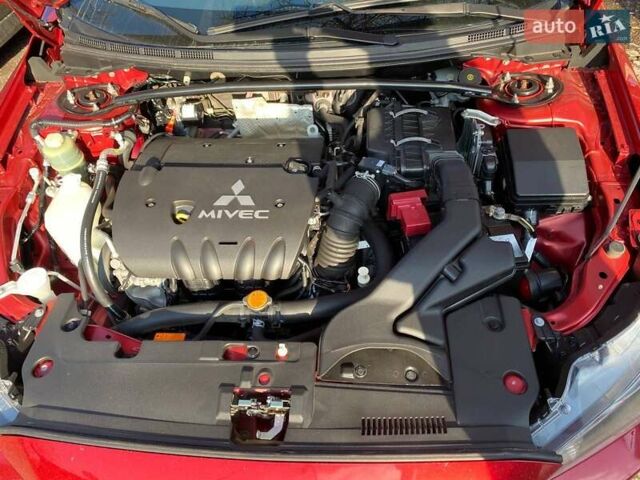 Красный Мицубиси Лансер, объемом двигателя 2 л и пробегом 66 тыс. км за 10000 $, фото 7 на Automoto.ua