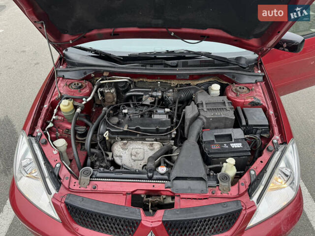 Красный Мицубиси Лансер, объемом двигателя 1.58 л и пробегом 285 тыс. км за 3650 $, фото 15 на Automoto.ua
