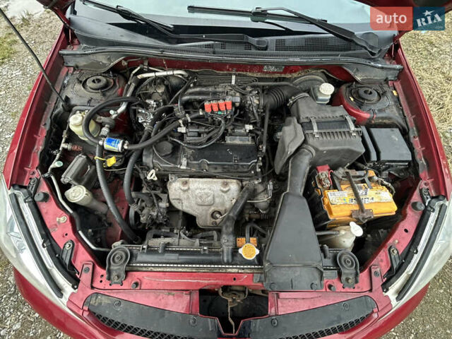 Красный Мицубиси Лансер, объемом двигателя 1.58 л и пробегом 280 тыс. км за 3250 $, фото 11 на Automoto.ua