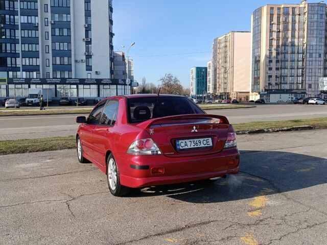 Червоний Міцубісі Lancer, об'ємом двигуна 2 л та пробігом 163 тис. км за 5500 $, фото 4 на Automoto.ua