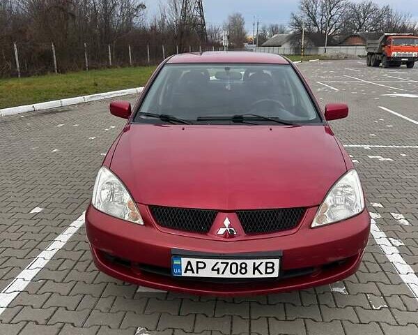 Красный Мицубиси Лансер, объемом двигателя 1.6 л и пробегом 176 тыс. км за 4300 $, фото 15 на Automoto.ua