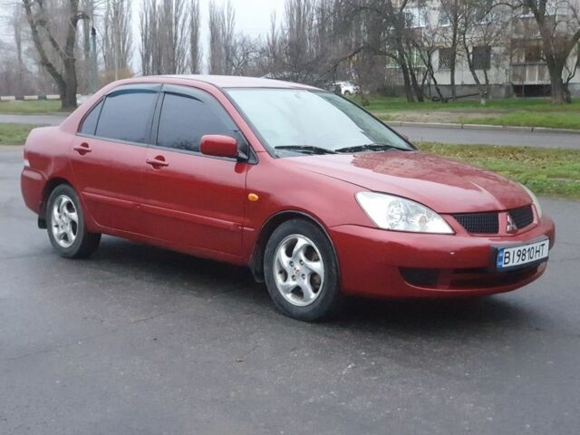 Красный Мицубиси Лансер, объемом двигателя 1.6 л и пробегом 250 тыс. км за 3700 $, фото 2 на Automoto.ua