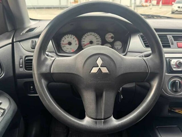 Мицубиси Лансер 2007 в Киеве на Automoto.ua Красный Мицубиси Лансер, объемом двигателя 1.6 л и пробегом 212 тыс. км за 5490 $, фото 13 на Automoto.ua