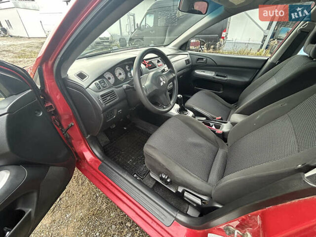 Красный Мицубиси Лансер, объемом двигателя 1.58 л и пробегом 280 тыс. км за 3250 $, фото 9 на Automoto.ua