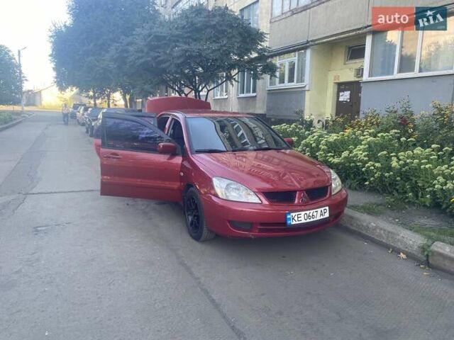 Красный Мицубиси Лансер, объемом двигателя 1.6 л и пробегом 210 тыс. км за 4200 $, фото 5 на Automoto.ua