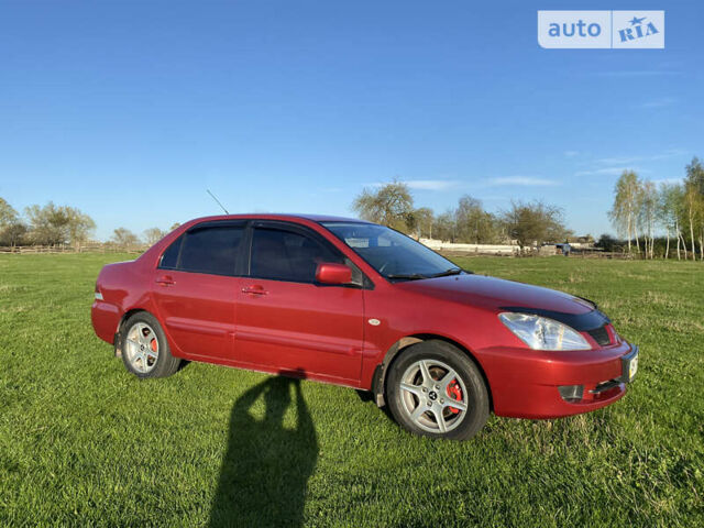 Червоний Міцубісі Lancer, об'ємом двигуна 1.6 л та пробігом 130 тис. км за 5800 $, фото 4 на Automoto.ua