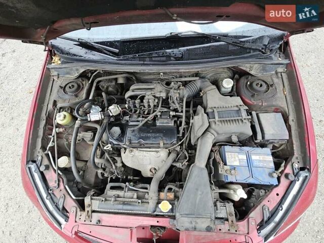 Червоний Міцубісі Lancer, об'ємом двигуна 1.6 л та пробігом 267 тис. км за 2999 $, фото 19 на Automoto.ua