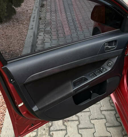 Красный Мицубиси Лансер, объемом двигателя 2 л и пробегом 261 тыс. км за 7200 $, фото 10 на Automoto.ua