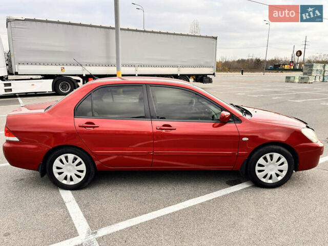 Червоний Міцубісі Lancer, об'ємом двигуна 1.6 л та пробігом 194 тис. км за 5500 $, фото 17 на Automoto.ua