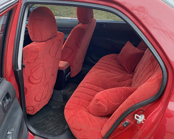 Червоний Міцубісі Lancer, об'ємом двигуна 1.58 л та пробігом 151 тис. км за 5600 $, фото 13 на Automoto.ua