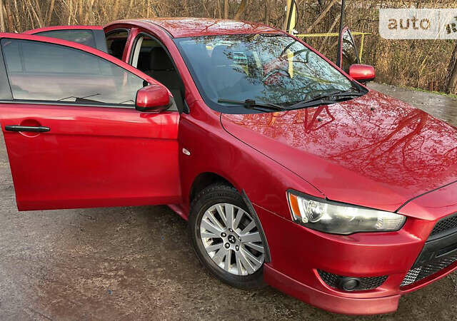 Червоний Міцубісі Lancer, об'ємом двигуна 2 л та пробігом 175 тис. км за 7500 $, фото 27 на Automoto.ua