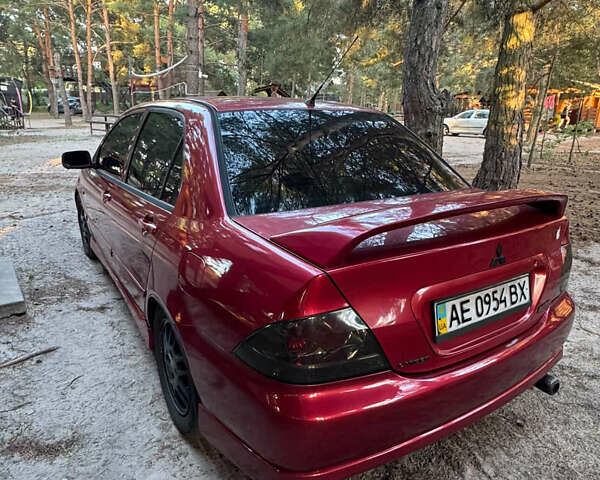 Червоний Міцубісі Lancer, об'ємом двигуна 2 л та пробігом 250 тис. км за 4500 $, фото 3 на Automoto.ua