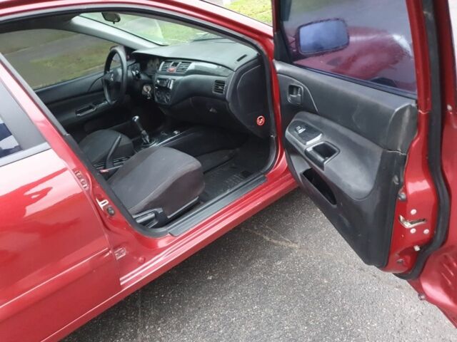 Красный Мицубиси Лансер, объемом двигателя 1.6 л и пробегом 250 тыс. км за 3700 $, фото 9 на Automoto.ua