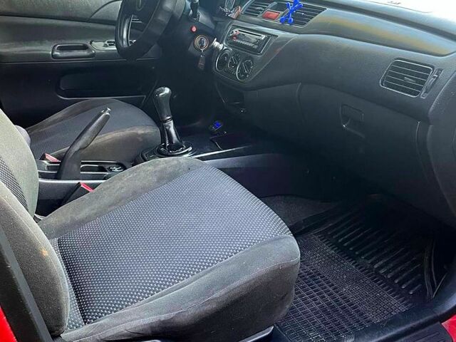 Червоний Міцубісі Lancer, об'ємом двигуна 1.6 л та пробігом 185 тис. км за 3900 $, фото 7 на Automoto.ua