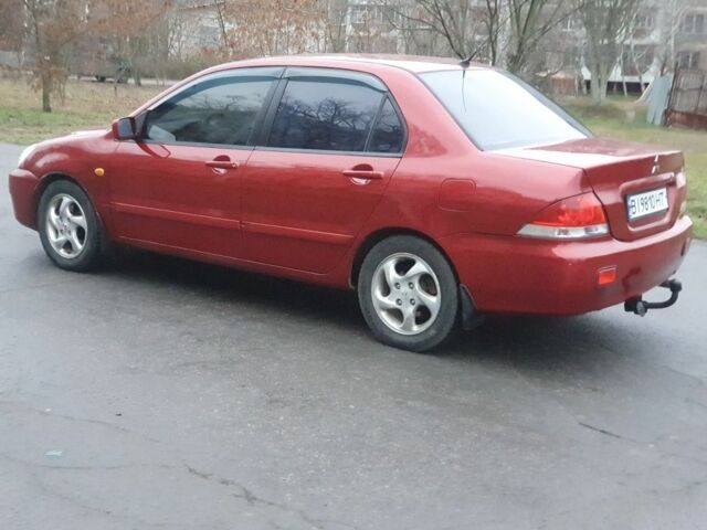 Красный Мицубиси Лансер, объемом двигателя 1.6 л и пробегом 250 тыс. км за 3700 $, фото 5 на Automoto.ua