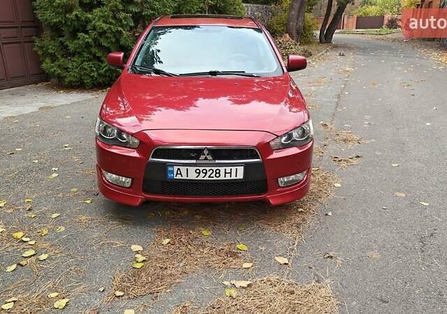 Красный Мицубиси Лансер, объемом двигателя 2 л и пробегом 186 тыс. км за 5600 $, фото 6 на Automoto.ua