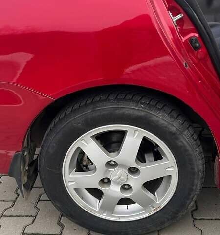 Красный Мицубиси Лансер, объемом двигателя 1.6 л и пробегом 176 тыс. км за 4300 $, фото 5 на Automoto.ua