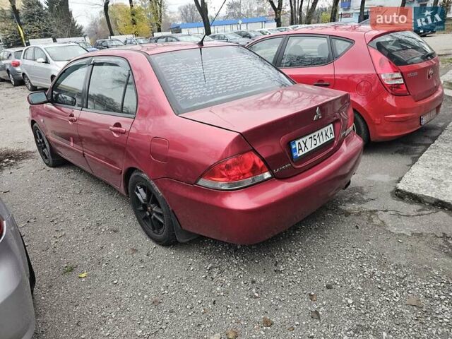 Червоний Міцубісі Lancer, об'ємом двигуна 1.6 л та пробігом 267 тис. км за 2999 $, фото 3 на Automoto.ua