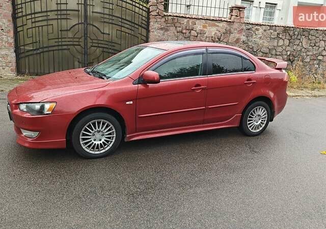 Червоний Міцубісі Lancer, об'ємом двигуна 2 л та пробігом 186 тис. км за 5600 $, фото 6 на Automoto.ua