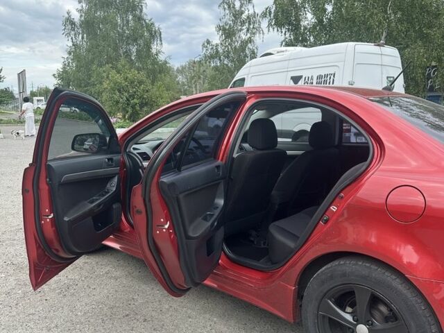 Червоний Міцубісі Lancer, об'ємом двигуна 2 л та пробігом 184 тис. км за 5999 $, фото 19 на Automoto.ua
