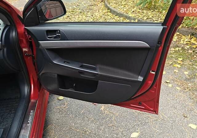 Червоний Міцубісі Lancer, об'ємом двигуна 2 л та пробігом 187 тис. км за 5500 $, фото 23 на Automoto.ua