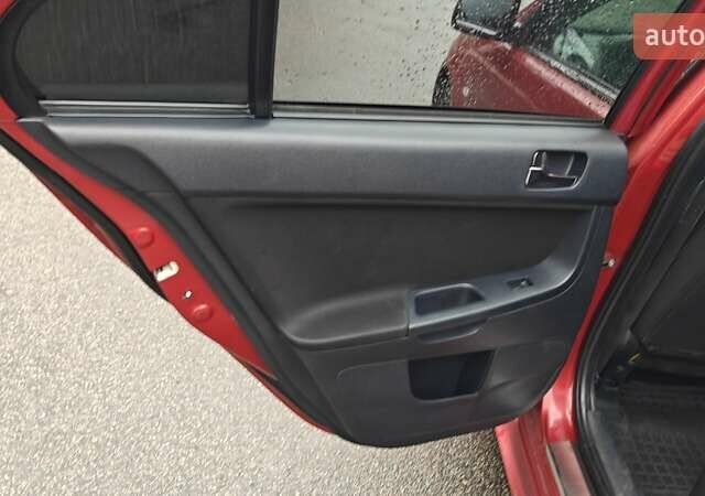 Червоний Міцубісі Lancer, об'ємом двигуна 2 л та пробігом 186 тис. км за 5600 $, фото 21 на Automoto.ua