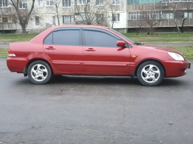 Красный Мицубиси Лансер, объемом двигателя 1.6 л и пробегом 250 тыс. км за 3700 $, фото 3 на Automoto.ua