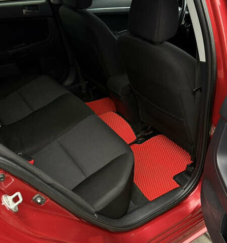 Красный Мицубиси Лансер, объемом двигателя 2 л и пробегом 261 тыс. км за 7200 $, фото 13 на Automoto.ua