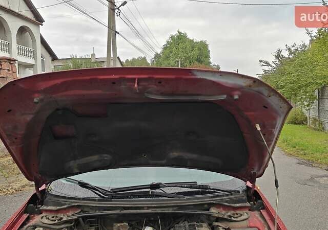 Червоний Міцубісі Lancer, об'ємом двигуна 2 л та пробігом 187 тис. км за 5600 $, фото 28 на Automoto.ua
