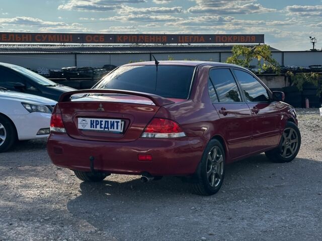 Красный Мицубиси Лансер, объемом двигателя 1.6 л и пробегом 230 тыс. км за 5300 $, фото 4 на Automoto.ua