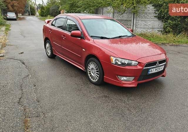 Червоний Міцубісі Lancer, об'ємом двигуна 2 л та пробігом 186 тис. км за 5600 $, фото 1 на Automoto.ua