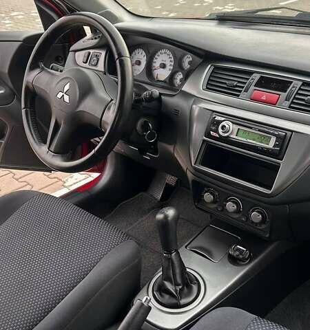 Красный Мицубиси Лансер, объемом двигателя 1.6 л и пробегом 176 тыс. км за 4300 $, фото 12 на Automoto.ua