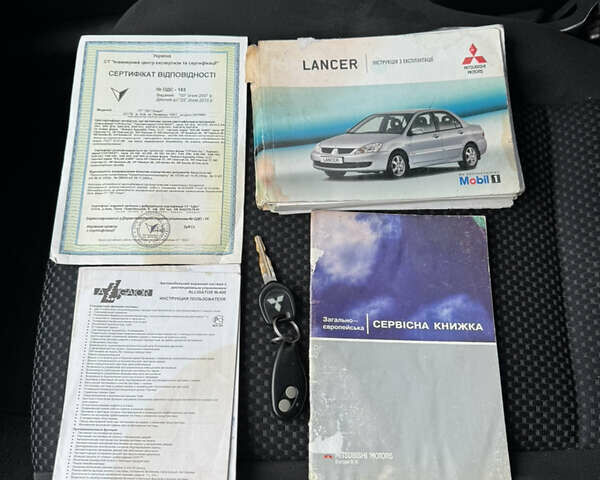 Красный Мицубиси Лансер, объемом двигателя 1.58 л и пробегом 285 тыс. км за 3650 $, фото 16 на Automoto.ua