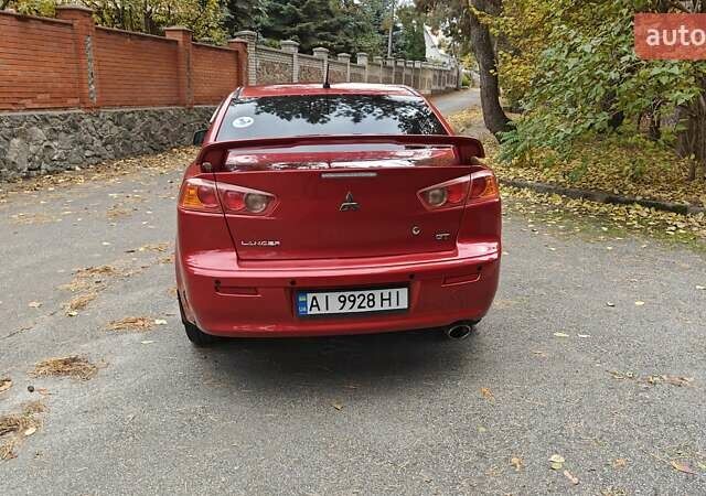 Красный Мицубиси Лансер, объемом двигателя 2 л и пробегом 186 тыс. км за 5600 $, фото 12 на Automoto.ua