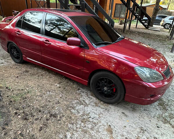 Червоний Міцубісі Lancer, об'ємом двигуна 2 л та пробігом 250 тис. км за 4500 $, фото 2 на Automoto.ua