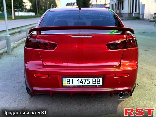 Красный Мицубиси Лансер, объемом двигателя 2 л и пробегом 180 тыс. км за 6500 $, фото 2 на Automoto.ua