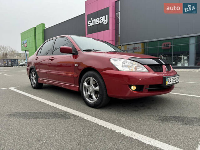 Красный Мицубиси Лансер, объемом двигателя 1.58 л и пробегом 285 тыс. км за 3650 $, фото 2 на Automoto.ua