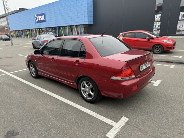 Красный Мицубиси Лансер, объемом двигателя 1.6 л и пробегом 285 тыс. км за 3650 $, фото 7 на Automoto.ua