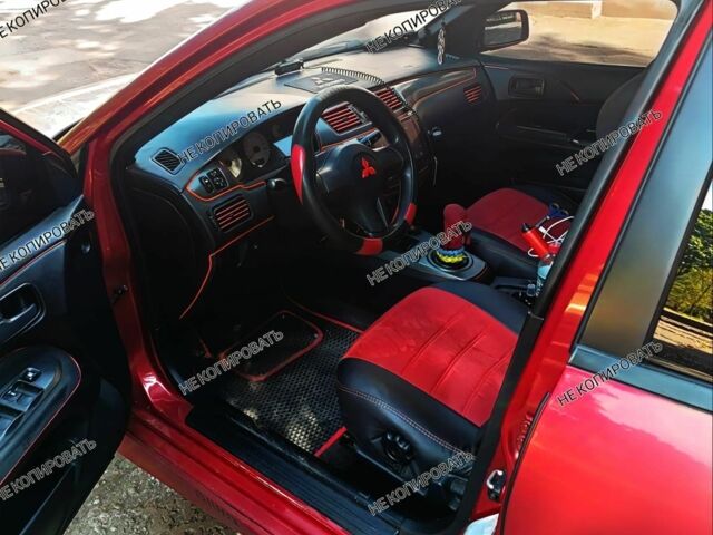 Красный Мицубиси Лансер, объемом двигателя 0 л и пробегом 252 тыс. км за 5400 $, фото 1 на Automoto.ua