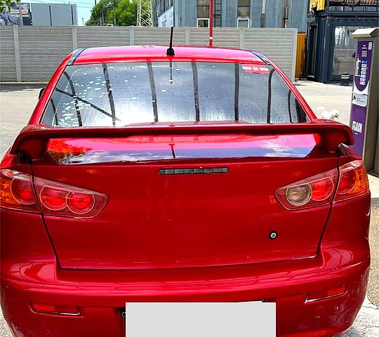 Красный Мицубиси Лансер, объемом двигателя 1.5 л и пробегом 145 тыс. км за 6500 $, фото 1 на Automoto.ua