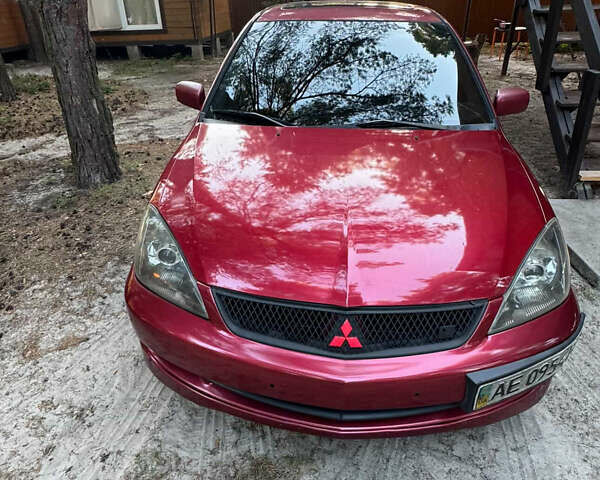 Червоний Міцубісі Lancer, об'ємом двигуна 2 л та пробігом 250 тис. км за 4500 $, фото 1 на Automoto.ua