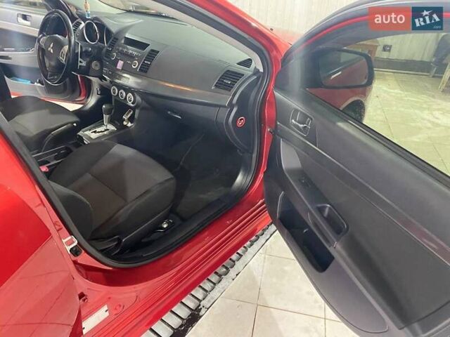 Красный Мицубиси Лансер, объемом двигателя 2 л и пробегом 66 тыс. км за 10000 $, фото 6 на Automoto.ua