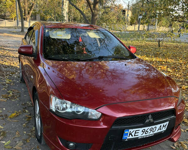 Красный Мицубиси Лансер, объемом двигателя 2 л и пробегом 196 тыс. км за 6300 $, фото 2 на Automoto.ua