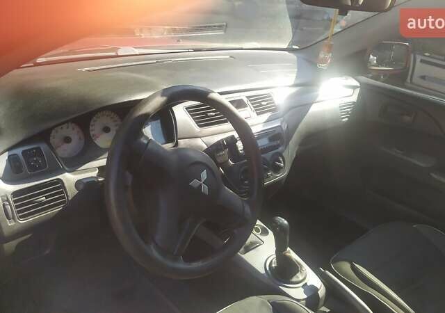 Червоний Міцубісі Lancer, об'ємом двигуна 1.58 л та пробігом 280 тис. км за 4300 $, фото 6 на Automoto.ua