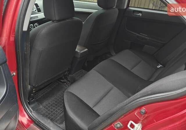 Червоний Міцубісі Lancer, об'ємом двигуна 2 л та пробігом 186 тис. км за 5600 $, фото 20 на Automoto.ua